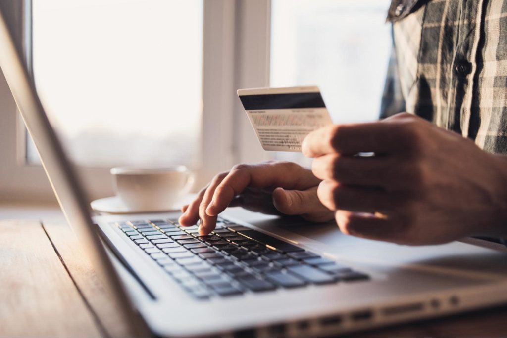 An online shopper inputting their credit card info while shopping online.