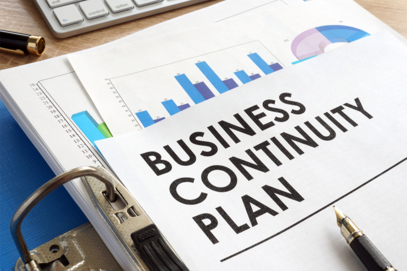interruption of business showing notebook entitled business continuity plan